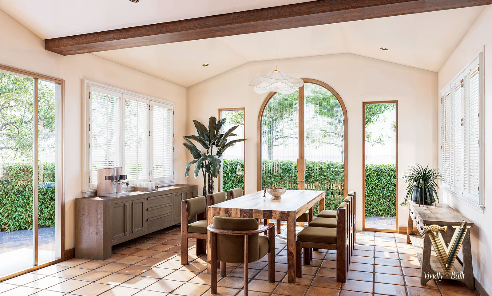 Kitchen view with custom Santa Fe-style millwork and curated stone countertops — Mediterranean Estate, Pasadena