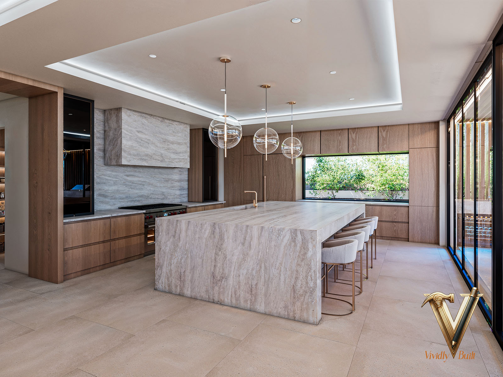 Chef's kitchen with travertine waterfall island, rift-oak cabinetry, marble hood and glass globe pendants — Modern Estate, Palos Verdes