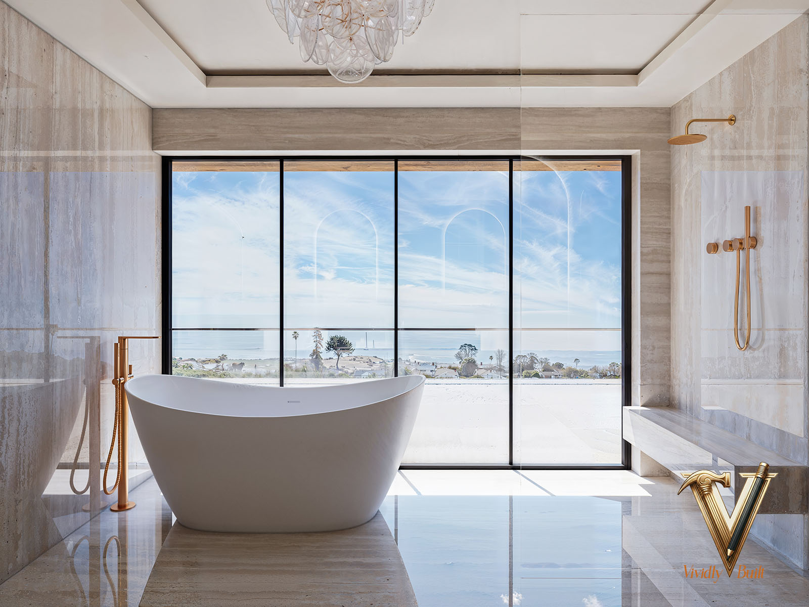 Primary bath in full-height travertine with freestanding tub, brass fixtures and ocean-view glazing — Modern Estate, Palos Verdes