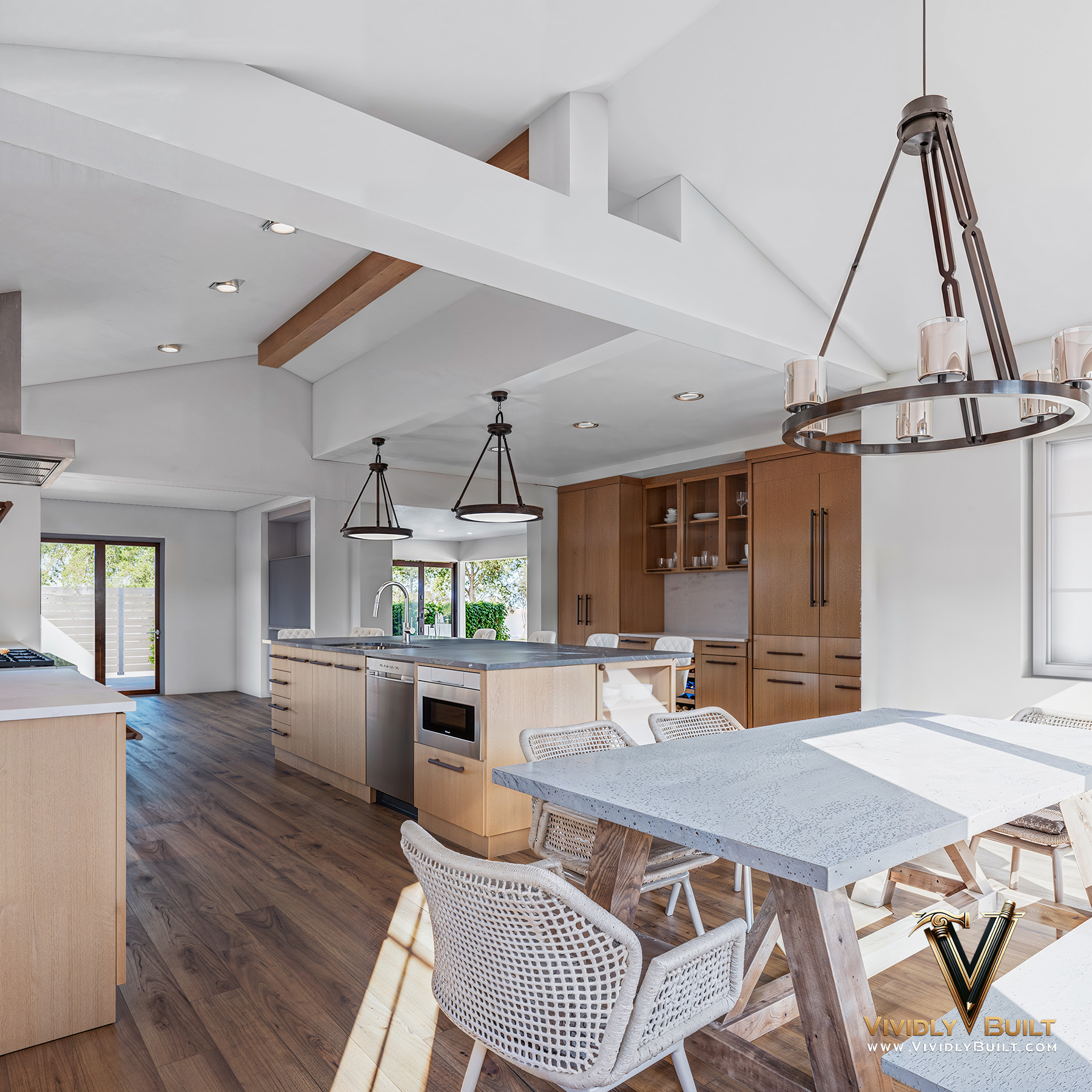 Open plan view from kitchen to living room rendering for a luxury Newport Beach residence by Vividly Built